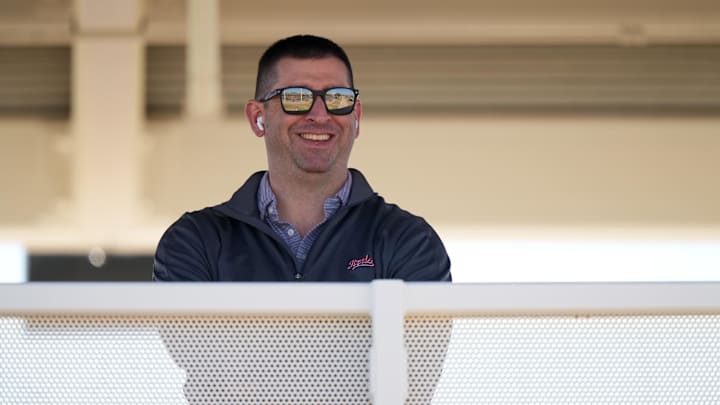 Feb 16, 2024; Goodyear, AZ, USA; Cincinnati Reds President of Baseball Operations Nick Krall smiles as he takes a phone call during spring training workouts. Mandatory Credit: Kareem Elgazzar/The Enquirer-Imagn Images Feb 16, 2024; Goodyear, AZ, USA; Cincinnati Reds President of Baseball Operations Nick Krall smiles as he takes a phone call during spring training workouts. Mandatory Credit: Kareem Elgazzar/The Enquirer-Imagn Images
