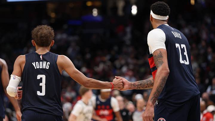 Oct 21, 2026; Washington, District of Columbia, USA; Washington Wizards guard Trae Young (3) celebrates with Wizards forward Anthony Davis (23) in the final minute against the Milwaukee Bucks at Capital One Arena. Mandatory Credit: Geoff Burke-Imagn Images