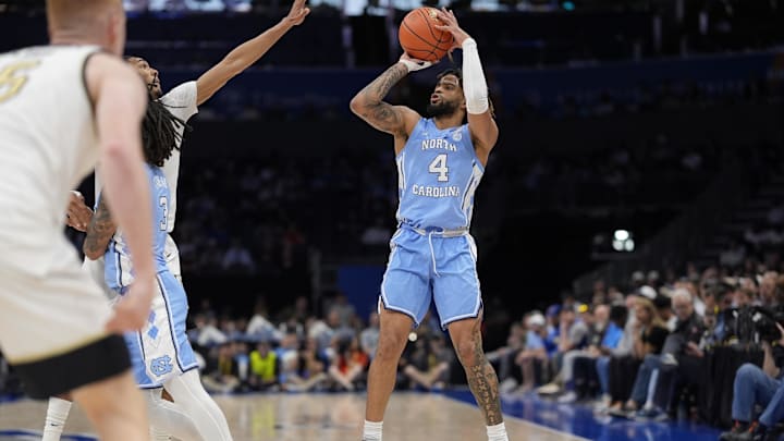 Mar 13, 2025; Charlotte, NC, USA; North Carolina Tar Heels guard RJ Davis (4) shoots a jumper against the Wake Forest Demon Deacons during the first half at Spectrum Center. Mandatory Credit: Jim Dedmon-Imagn Images