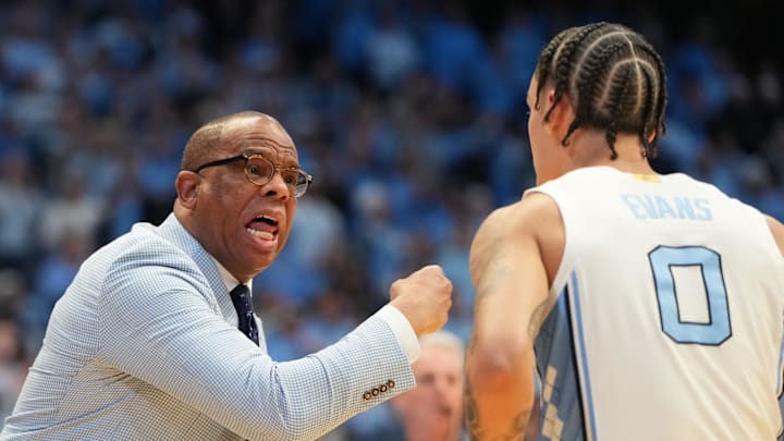 Feb 7, 2026; Chapel Hill, North Carolina, USA; North Carolina Tar Heels head coach Hubert Davis with guard Kyan Evans (0) in the first half at Dean E. Smith Center. Mandatory Credit: Bob Donnan-Imagn Images Feb 7, 2026; Chapel Hill, North Carolina, USA; North Carolina Tar Heels head coach Hubert Davis with guard Kyan Evans (0) in the first half at Dean E. Smith Center. Mandatory Credit: Bob Donnan-Imagn Images