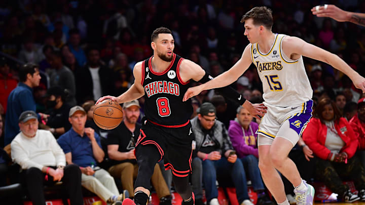 Mar 26, 2023; Los Angeles, California, USA; Chicago Bulls guard Zach LaVine (8) moves the ball up court against Los Angeles Lakers guard Austin Reaves (15) during the second half at Crypto.com Arena. Mandatory Credit: Gary A. Vasquez-Imagn Images