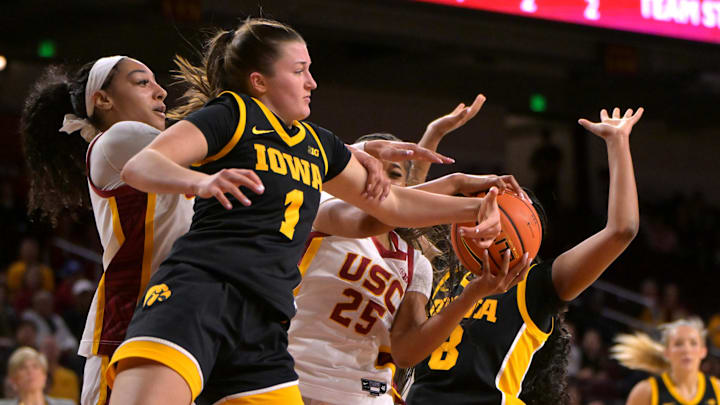 Jan 29, 2026; Los Angeles, California, USA; USC Trojans guard Kennedy Smith (11), guard Kara Dunn (25), Iowa Hawkeyes guard Taylor Stremlow (1) and guard Journey Houston (8) fight for a rebound in the second half at Galen Center. Mandatory Credit: Jayne Kamin-Oncea-Imagn Images Jan 29, 2026; Los Angeles, California, USA; USC Trojans guard Kennedy Smith (11), guard Kara Dunn (25), Iowa Hawkeyes guard Taylor Stremlow (1) and guard Journey Houston (8) fight for a rebound in the second half at Galen Center. Mandatory Credit: Jayne Kamin-Oncea-Imagn Images