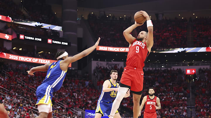 Houston Rockets forward Dillon Brooks shoots the ball as Golden State Warriors guard Moses Moody defends during the fourth quarter during game two of the first round for the 2024 NBA Playoffs at Toyota Center. Mandatory Credit: Troy Taormina-Imagn Images