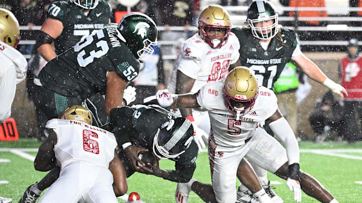 Sep 21, 2024; Chestnut Hill, Massachusetts, USA; Michigan State Spartans quarterback Aidan Chiles (2) is tackled by the Boston College Eagles during the second half at Alumni Stadium. Mandatory Credit: Eric Canha-Imagn Images