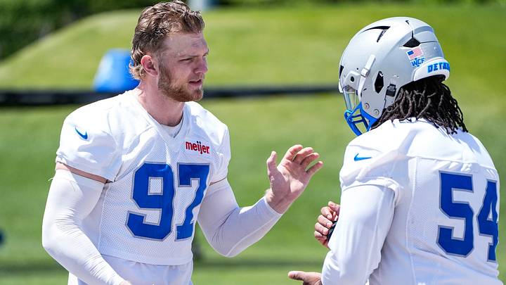 Detroit Lions defensive end Aidan Hutchinson (97), left, plays a round of rock, paper, scissors with defensive tackle Alim McNeill (54) after practice during OTAs at Meijer Performance Center in Allen Park on Friday, May 29, 2026. Detroit Lions defensive end Aidan Hutchinson (97), left, plays a round of rock, paper, scissors with defensive tackle Alim McNeill (54) after practice during OTAs at Meijer Performance Center in Allen Park on Friday, May 29, 2026.