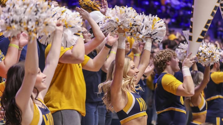 Mar 8, 2025; Morgantown, West Virginia, USA; West Virginia Mountaineers cheerleaders perform during the second half against the UCF Knights at WVU Coliseum. Mandatory Credit: Ben Queen-Imagn Images Mar 8, 2025; Morgantown, West Virginia, USA; West Virginia Mountaineers cheerleaders perform during the second half against the UCF Knights at WVU Coliseum. Mandatory Credit: Ben Queen-Imagn Images