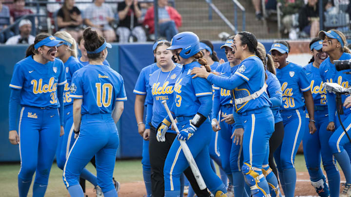 Jun 2, 2024; Oklahoma City, OK, USA; UCLA Bruins players celebrate after utility Megan Grant (43) hit a home run in the second inning against the Stanford Cardinals during a Women's College World Series softball losers bracket elimination game at Devon Park. Mandatory Credit: Brett Rojo-Imagn Images Jun 2, 2024; Oklahoma City, OK, USA; UCLA Bruins players celebrate after utility Megan Grant (43) hit a home run in the second inning against the Stanford Cardinals during a Women's College World Series softball losers bracket elimination game at Devon Park. Mandatory Credit: Brett Rojo-Imagn Images