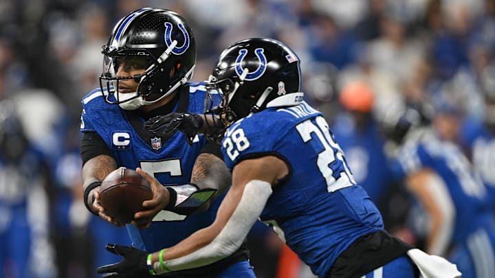 Nov 24, 2024; Indianapolis, Indiana, USA; Indianapolis Colts quarterback Anthony Richardson (5) hands the ball off to Indianapolis Colts running back Jonathan Taylor (28) during the second quarter against the Detroit Lions at Lucas Oil Stadium. Mandatory Credit: Marc Lebryk-Imagn Images Nov 24, 2024; Indianapolis, Indiana, USA; Indianapolis Colts quarterback Anthony Richardson (5) hands the ball off to Indianapolis Colts running back Jonathan Taylor (28) during the second quarter against the Detroit Lions at Lucas Oil Stadium. Mandatory Credit: Marc Lebryk-Imagn Images