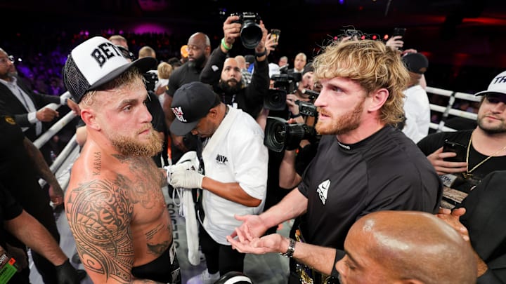 Jake Paul is congratulated by Logan Paul after knocking out Andre August in the first round at the Caribe Royale Orlando. Mandatory Credit: Nathan Ray Seebeck-Imagn Images