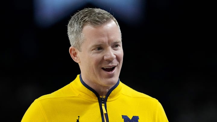 Michigan Wolverines head coach Dusty May talks with his team Monday, April 6, 2026, during the NCAA men's basketball tournament national championship game against the UConn Huskies at Lucas Oil Stadium in Indianapolis.
