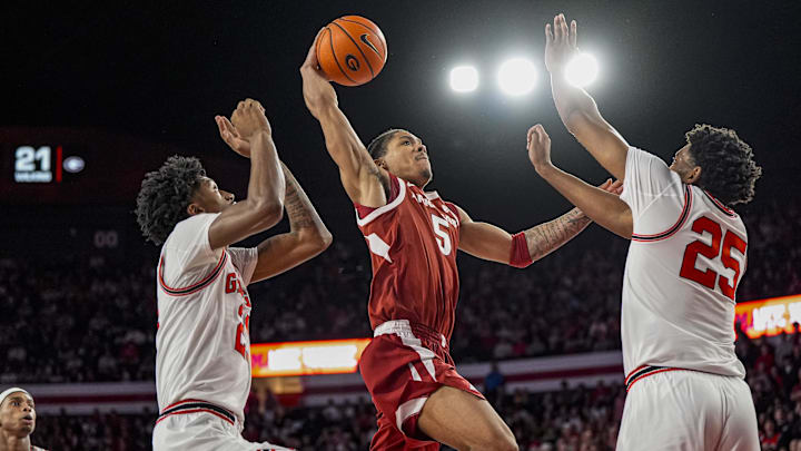 Jan 17, 2026; Athens, Georgia, USA; Arkansas Razorbacks guard Darius Acuff Jr. (5) tries to get to the basket against Georgia Bulldogs forward Justin Abson (25) during the second half at Stegeman Coliseum. Mandatory Credit: Dale Zanine-Imagn Images