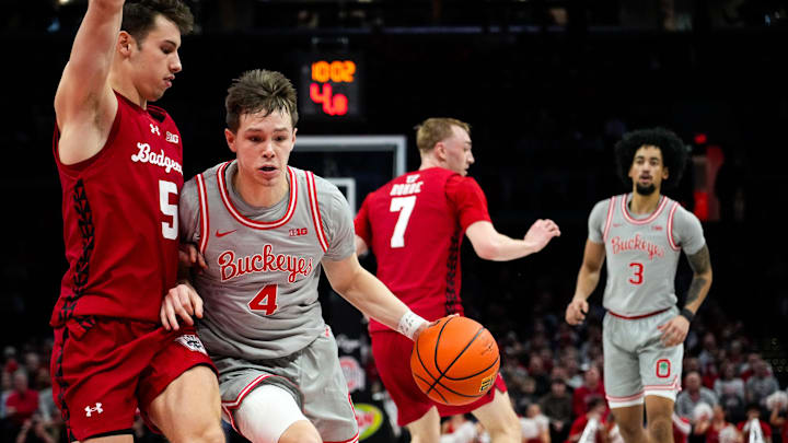 Ohio State Buckeyes guard Gabe Cupps (4) dribbles the ball against Wisconsin Badgers guard Jack Janicki (5) in the first half of the NCAA game at Value City Arena on Tuesday, Feb. 17, 2026 in Columbus, Ohio.