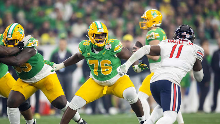 Jan 1, 2024; Glendale, AZ, USA; Oregon Ducks offensive lineman Josh Conerly Jr. (76) against the Liberty Flames