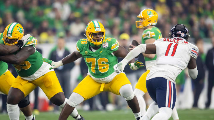 Jan 1, 2024; Glendale, AZ, USA; Oregon Ducks offensive lineman Josh Conerly Jr. (76) against the Liberty Flames during the 2024 Fiesta Bowl at State Farm Stadium. Mandatory Credit: Mark J. Rebilas-USA TODAY Sports