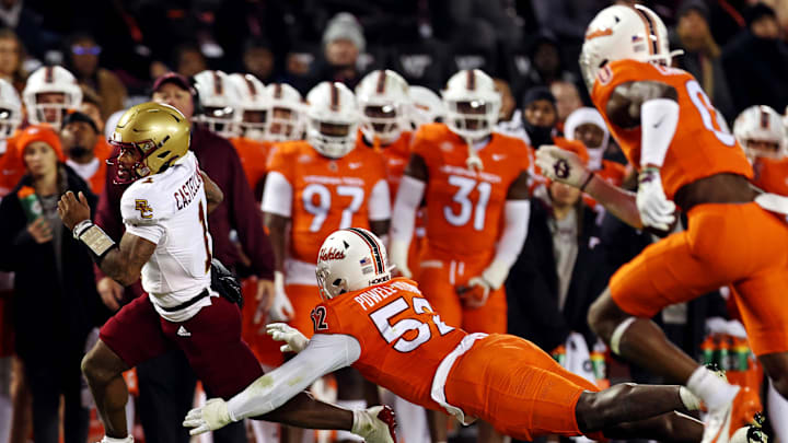 Oct 17, 2024; Blacksburg, Virginia, USA; Boston College Eagles quarterback Thomas Castellanos (1) runs the ball against Virginia Tech Hokies defensive lineman James Jennette (57) during the second quarter at Lane Stadium. Mandatory Credit: Peter Casey-Imagn Images