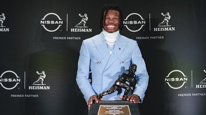 Dec 14, 2024; New York, NY, USA; Colorado Buffaloes wide receiver/cornerback Travis Hunter poses for a photo after winning the Heisman Trophy award during the 2024 Heisman Trophy Presentation. Mandatory Credit: Lucas Boland-Imagn Images