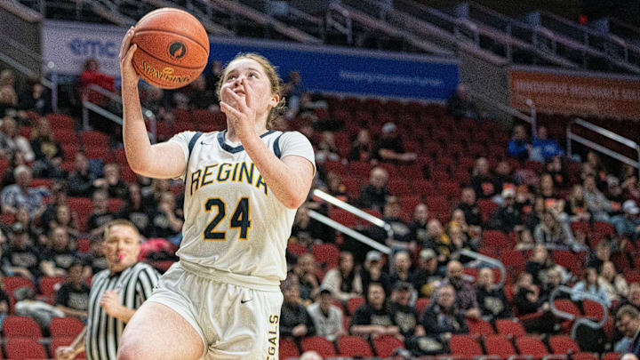 Iowa City Regina's Addie McLaughlin attempts a layup during the IGHSAU state basketball tournament at Wells Fargo Arena on Wednesday, March 5, 2025, in Des Moines.