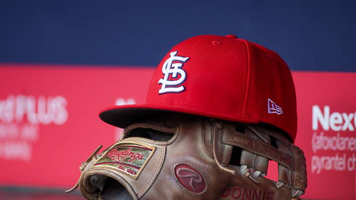 Apr 21, 2025; Atlanta, Georgia, USA; A St. Louis Cardinals hat and glove in the dugout against the Atlanta Braves in the first inning at Truist Park. Mandatory Credit: Brett Davis-Imagn Images Apr 21, 2025; Atlanta, Georgia, USA; A St. Louis Cardinals hat and glove in the dugout against the Atlanta Braves in the first inning at Truist Park. Mandatory Credit: Brett Davis-Imagn Images