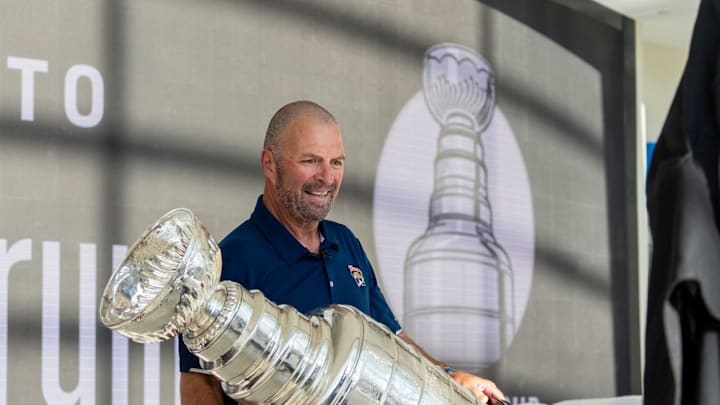 Panthers General Manager Bill Zito places the Stanley Cup on a table on Wednesday August 14, 2024 at Fiserv Forum in Milwaukee, Wis.