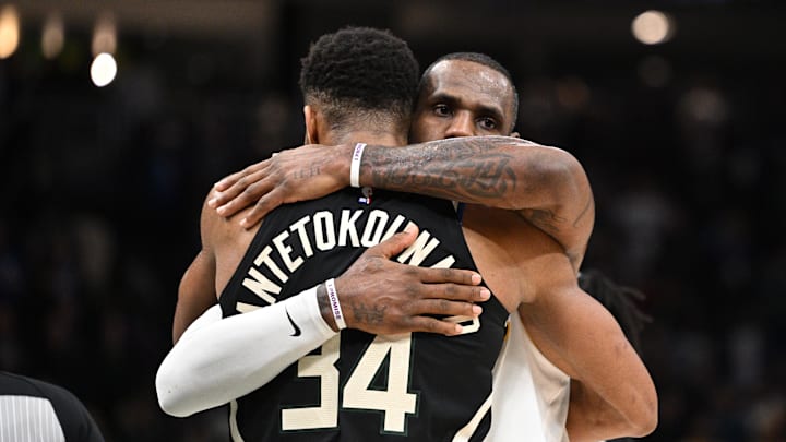 Dec 2, 2022; Milwaukee, Wisconsin, USA; Los Angeles Lakers forward LeBron James (6) and Milwaukee Bucks forward Giannis Antetokounmpo (34) exchange hugs after the Los Angeles Lakers 133-129 win over the Milwaukee Bucks at Fiserv Forum. Mandatory Credit: Michael McLoone-Imagn Images