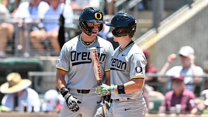 Jun 8, 2024; College Station, TX, USA; Oregon outfielder Mason Neville (right) and designated hitter Chase Meggers (left) wait at home plate for outfielder Anson Aroz (not picutred) to round the bases after hitting a home run during the first inning against the Texas A&M at Olsen Field, Blue Bell Park Mandatory Credit: Maria Lysaker-Imagn Images Jun 8, 2024; College Station, TX, USA; Oregon outfielder Mason Neville (right) and designated hitter Chase Meggers (left) wait at home plate for outfielder Anson Aroz (not picutred) to round the bases after hitting a home run during the first inning against the Texas A&M at Olsen Field, Blue Bell Park Mandatory Credit: Maria Lysaker-Imagn Images