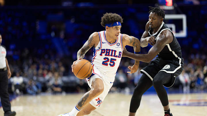 Oct 16, 2024; Philadelphia, Pennsylvania, USA; Philadelphia 76ers guard Lester Quinones (25) and Brooklyn Nets forward Dorian Finney-Smith (28) in action during the fourth quarter at Wells Fargo Center. Mandatory Credit: Bill Streicher-Imagn Images