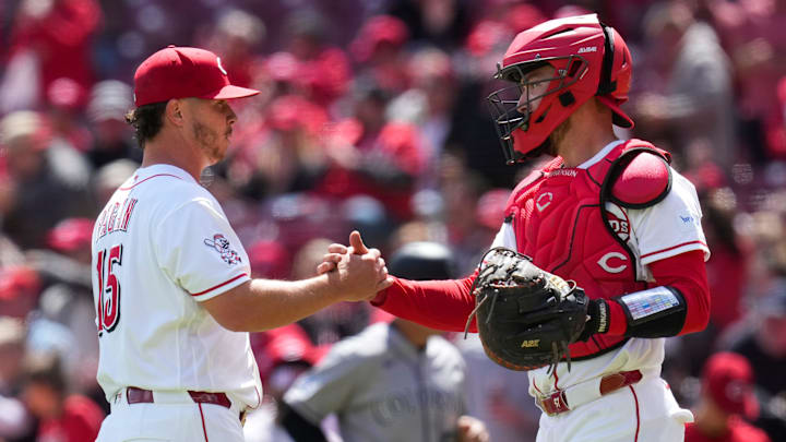 Cincinnati Reds pitcher Emilio Pagán (15) and catcher Tyler Stephenson (37) celebrate a win after the ninth inning of the MLB National League game between the Cincinnati Reds and the Colorado Rockies at Great American Ball Park in downtown Cincinnati on Thursday, April 30, 2026. The Reds won 6-4.