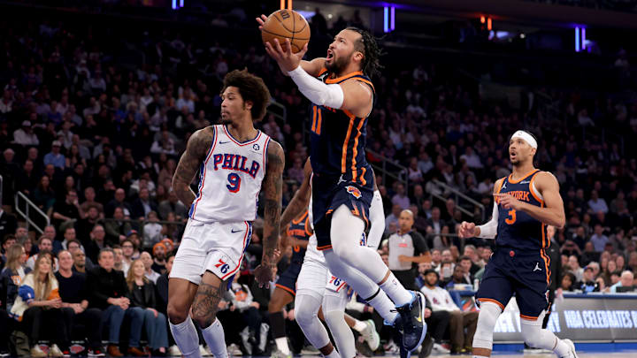 Feb 26, 2025; New York, New York, USA; New York Knicks guard Jalen Brunson (11) drives to the basket against Philadelphia 76ers guard Kelly Oubre Jr. (9) during the first quarter at Madison Square Garden. Mandatory Credit: Brad Penner-Imagn Images