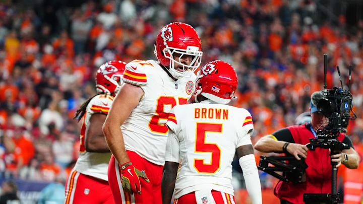 Nov 16, 2025; Denver, Colorado, USA; Kansas City Chiefs tight end Travis Kelce (87) celebrates his touchdown with wide receiver Marquise Brown (5) in the fourth quarter against the Denver Broncos at Empower Field at Mile High. Mandatory Credit: Ron Chenoy-Imagn Images Nov 16, 2025; Denver, Colorado, USA; Kansas City Chiefs tight end Travis Kelce (87) celebrates his touchdown with wide receiver Marquise Brown (5) in the fourth quarter against the Denver Broncos at Empower Field at Mile High. Mandatory Credit: Ron Chenoy-Imagn Images