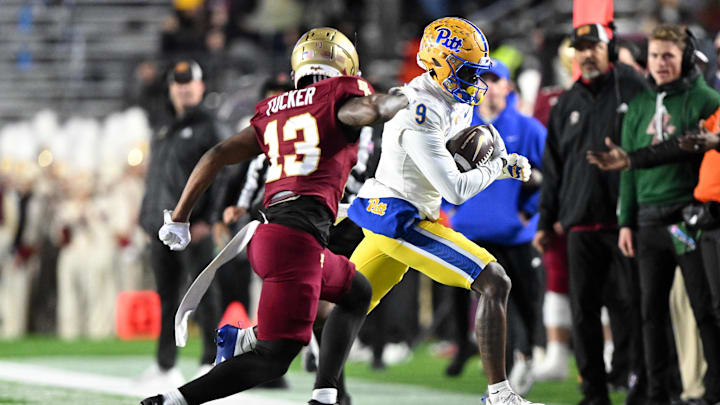 Nov 30, 2024; Chestnut Hill, Massachusetts, USA; Pittsburgh Panthers wide receiver Konata Mumpfield (9) runs against Boston College Eagles defensive back Max Tucker (13) during the first half at Alumni Stadium. Mandatory Credit: Brian Fluharty-Imagn Images
