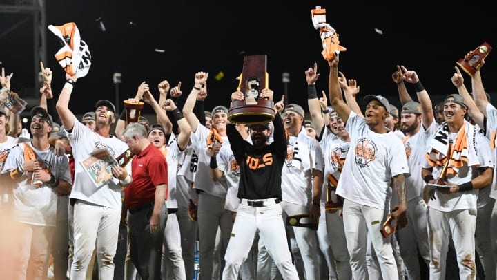 Jun 24, 2024; Omaha, NE, USA;  Tennessee Volunteers head coach Tony Vitello holds the national championship trophy after the win against the Texas A&M Aggies at Charles Schwab Field Omaha. Mandatory Credit: Steven Branscombe-USA TODAY Sports