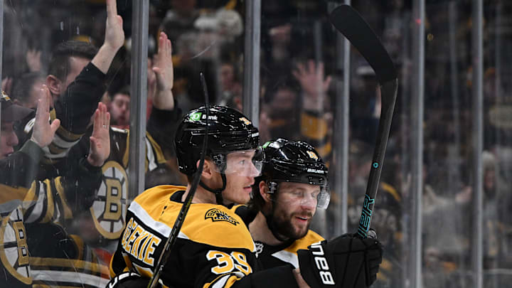 Jan 25, 2025; Boston, Massachusetts, USA; Boston Bruins center Morgan Geekie (39) celebrates with center Pavel Zacha (18) after scoring a goal against the Colorado Avalanche during the third period at the TD Garden. Mandatory Credit: Brian Fluharty-Imagn Images
