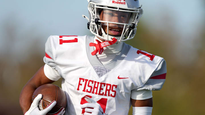 Fishers' Jonanthony Hall (11) runs with the ball during practice Friday, Sept. 13, 2024, before a game against Hamilton Southeastern at Hamilton Southeastern High School in Fishers. Fishers' Jonanthony Hall (11) runs with the ball during practice Friday, Sept. 13, 2024, before a game against Hamilton Southeastern at Hamilton Southeastern High School in Fishers.