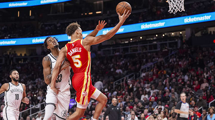 Oct 23, 2024; Atlanta, Georgia, USA; Brooklyn Nets center Nic Claxton (33) commits a flagrant two foul resulting in ejection on Atlanta Hawks guard Dyson Daniels (5) during the second half at State Farm Arena. Mandatory Credit: Dale Zanine-Imagn Images