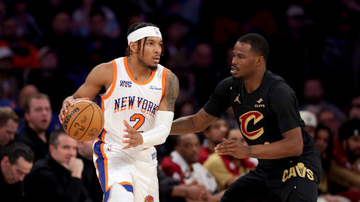 New York Knicks guard Miles McBride controls the ball against Cleveland Cavaliers guard Javonte Green. Mandatory Credit: Brad Penner-Imagn Images