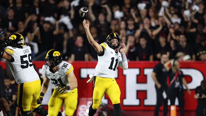 Sep 19, 2025; Piscataway, New Jersey, USA; Iowa Hawkeyes quarterback Mark Gronowski (11) throws a pass during the first half against the Rutgers Scarlet Knights at SHI Stadium. Mandatory Credit: Vincent Carchietta-Imagn Images