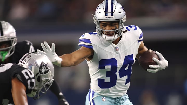 Dallas Cowboys running back Malik Davis runs the ball against the Las Vegas Raiders at AT&T Stadium. 