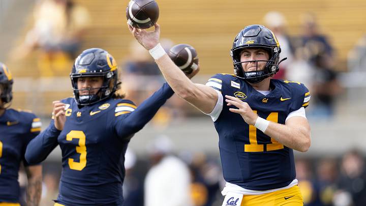 Cal quarterbacks Jaron-Keawe Sagapolutele (3) and Jackson Brousseau (11) warmed up before facing Virginia Tech. Sagapolutele did not play