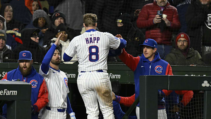 Apr 7, 2025; Chicago, Illinois, USA;  Chicago Cubs outfielder Ian Happ (8) celebrates with manager Craig Counsell (11), right, after he scores against the Texas Rangers during the sixth inning at Wrigley Field. Mandatory Credit: Matt Marton-Imagn Images