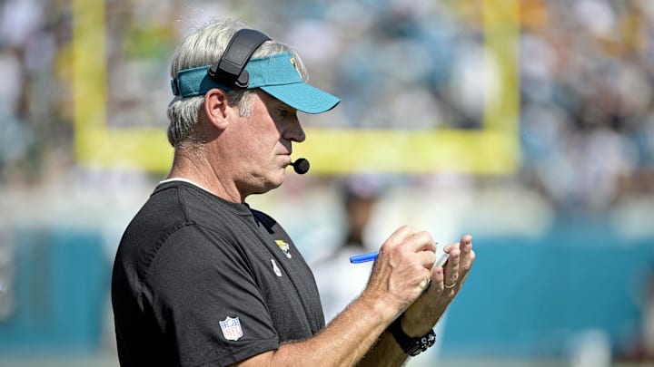 Oct 27, 2024; Jacksonville, Florida, USA; Jacksonville Jaguars head coach Doug Pederson takes notes during the first half against the Green Bay Packers at EverBank Stadium. Mandatory Credit: Melina Myers-Imagn Images