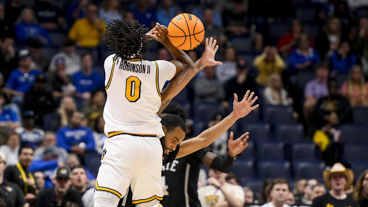  Mar 13, 2025; Nashville, TN, USA;  Missouri Tigers guard Anthony Robinson II (0) draws the foul on Mississippi State Bulldogs guard Claudell Harris Jr. (0) during the second half at Bridgestone Arena. Mandatory Credit: Steve Roberts-Imagn Images