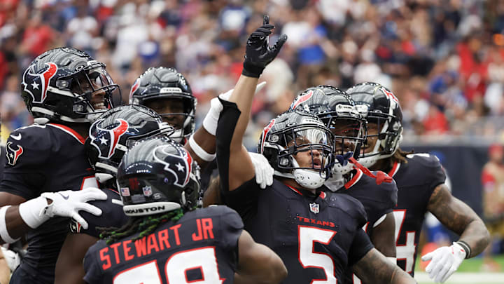 Oct 27, 2024; Houston, Texas, USA; Houston Texans safety Jalen Pitre (5) celebrates his interception with teammates against the Indianapolis Colts  in the second quarter at NRG Stadium. Mandatory Credit: Thomas Shea-Imagn Images