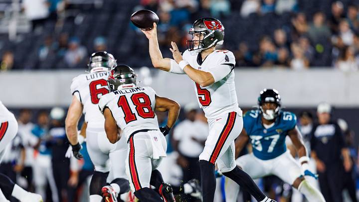 Ex-Husky quarterback Jake Browning (5) throws the ball in a Tampa Bay exhibition game against Jacksonville. Ex-Husky quarterback Jake Browning (5) throws the ball in a Tampa Bay exhibition game against Jacksonville.