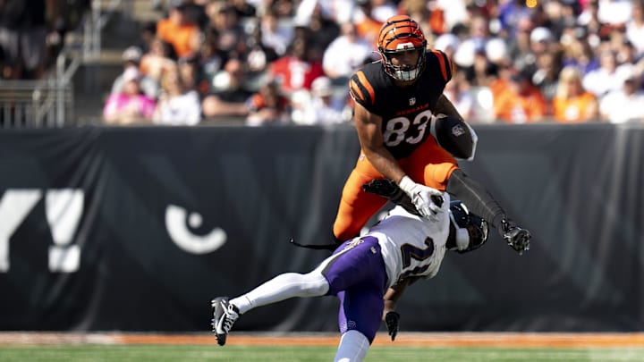 Cincinnati Bengals tight end Erick All Jr. (83) leaps over Baltimore Ravens defensive back Brandon Stephens (21) in the third quarter of the NFL game at Paycor Stadium in Cincinnati on Sunday, Oct. 6, 2024.