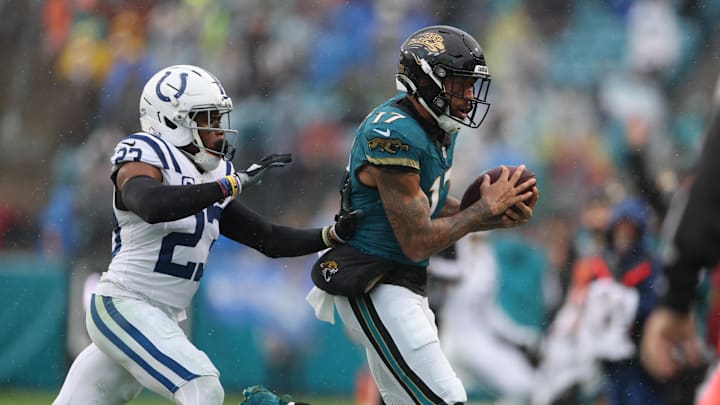 Dec 7, 2025; Jacksonville, Florida, USA;  Jacksonville Jaguars wide receiver Tim Patrick (17) makes the catch in front of Indianapolis Colts cornerback Kenny Moore II (23) during the second half at EverBank Stadium. Mandatory Credit: Matt Pendleton-Imagn Images