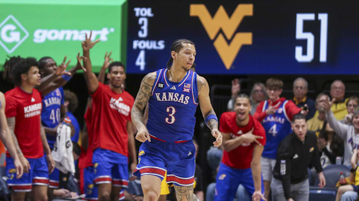 Jan 10, 2026; Morgantown, West Virginia, USA; Kansas Jayhawks guard Tre White (3) celebrates after a made three pointer during the second half against the West Virginia Mountaineers at Hope Coliseum. Mandatory Credit: Ben Queen-Imagn Images Jan 10, 2026; Morgantown, West Virginia, USA; Kansas Jayhawks guard Tre White (3) celebrates after a made three pointer during the second half against the West Virginia Mountaineers at Hope Coliseum. Mandatory Credit: Ben Queen-Imagn Images