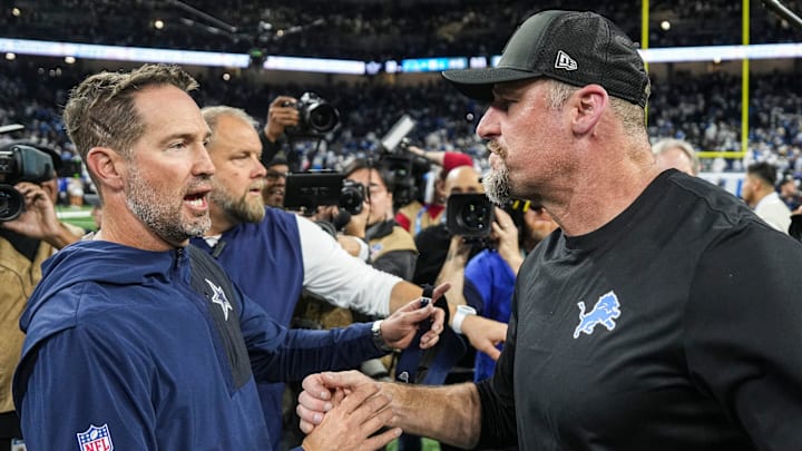 Detroit Lions head coach Dan Campbell shakes hands with Dallas Cowboys head coach Brian Schottenheimer Detroit Lions head coach Dan Campbell shakes hands with Dallas Cowboys head coach Brian Schottenheimer