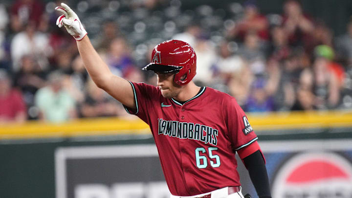 Arizona Diamondbacks' Connor Kaiser (65) celebrates his first major league hit, a double, against the Colorado Rockies at Chase Field on Aug. 10, 2025.