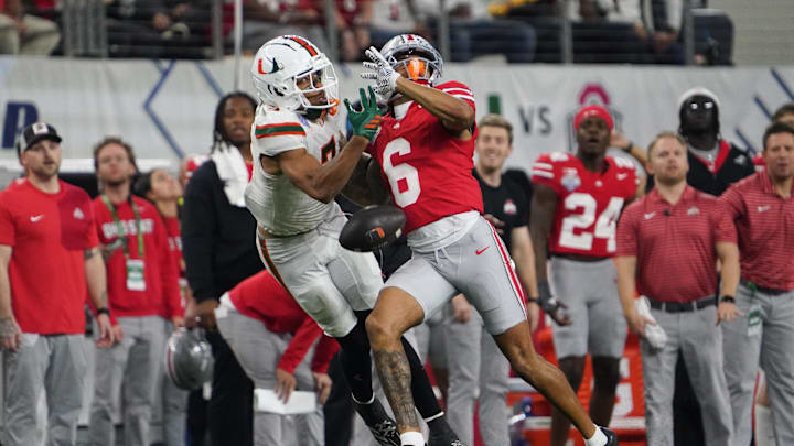 Dec 31, 2025; Arlington, TX, USA; Ohio State Buckeyes cornerback Devin Sanchez (6) blocks a pass intended for Miami Hurricanes wide receiver CJ Daniels (7) in the fourth quarter during the 2025 Cotton Bowl and quarterfinal game of the College Football Playoff at AT&T Stadium. Mandatory Credit: Raymond Carlin III-Imagn Images Dec 31, 2025; Arlington, TX, USA; Ohio State Buckeyes cornerback Devin Sanchez (6) blocks a pass intended for Miami Hurricanes wide receiver CJ Daniels (7) in the fourth quarter during the 2025 Cotton Bowl and quarterfinal game of the College Football Playoff at AT&T Stadium. Mandatory Credit: Raymond Carlin III-Imagn Images