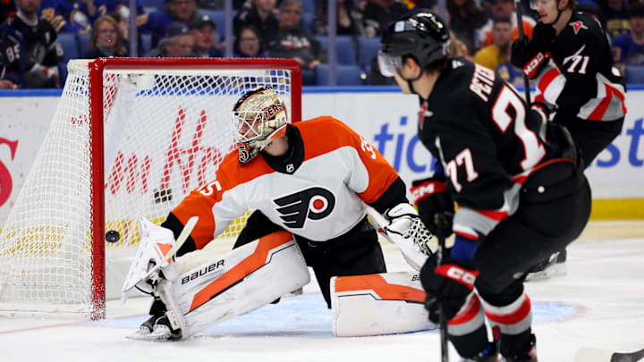 Apr 17, 2025; Buffalo, New York, USA;  Buffalo Sabres right wing JJ Peterka (77) scores a goal on Philadelphia Flyers goaltender Aleksei Kolosov (35) during the second period at KeyBank Center. Mandatory Credit: Timothy T. Ludwig-Imagn Images